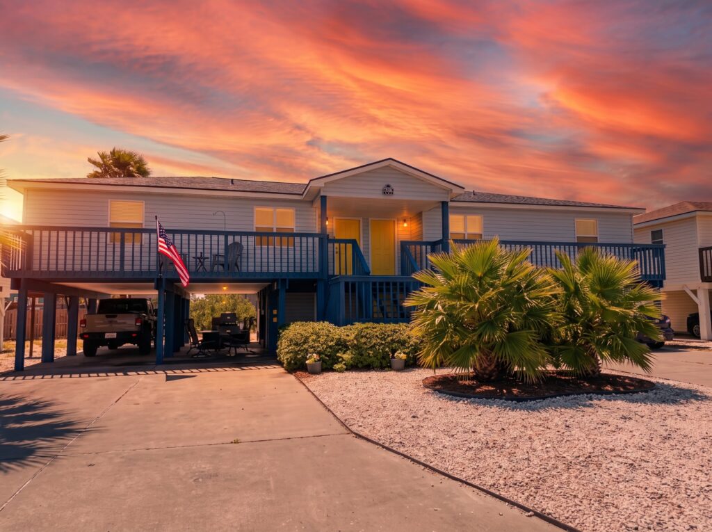 Casa Azul at dusk with the fenced yard