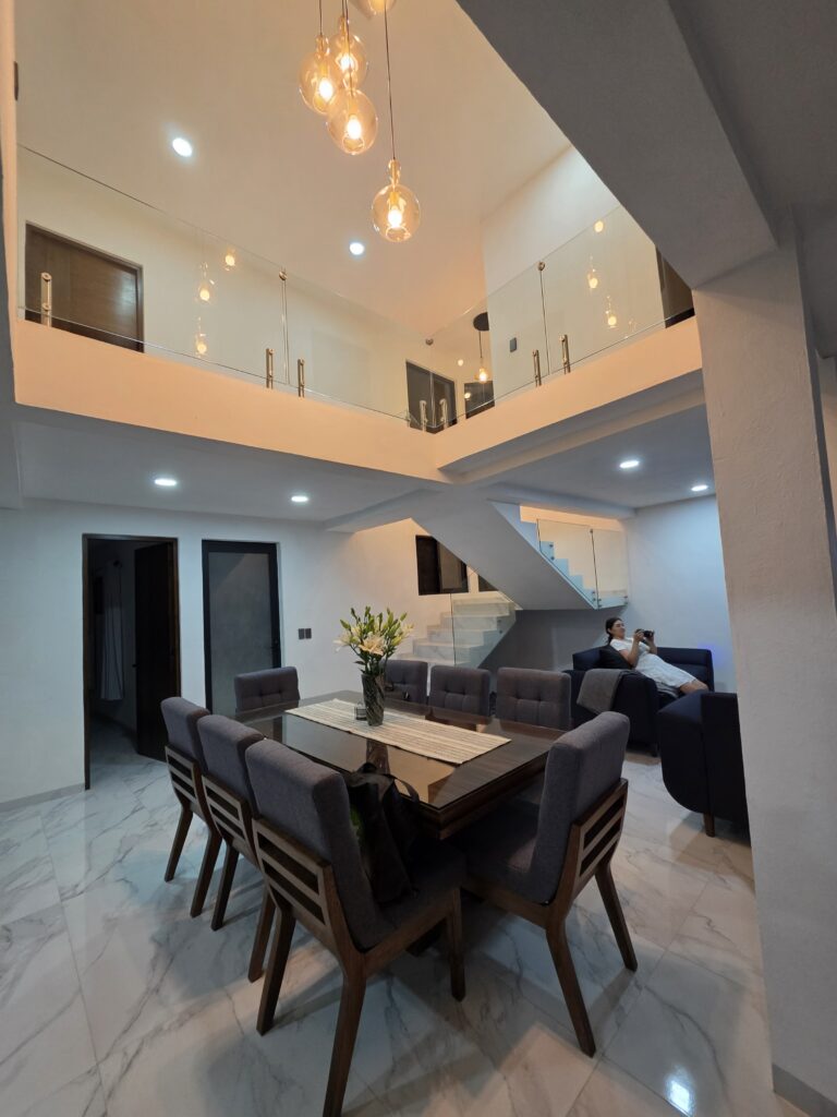 Casa Luna open living and dining area under a double-height ceiling